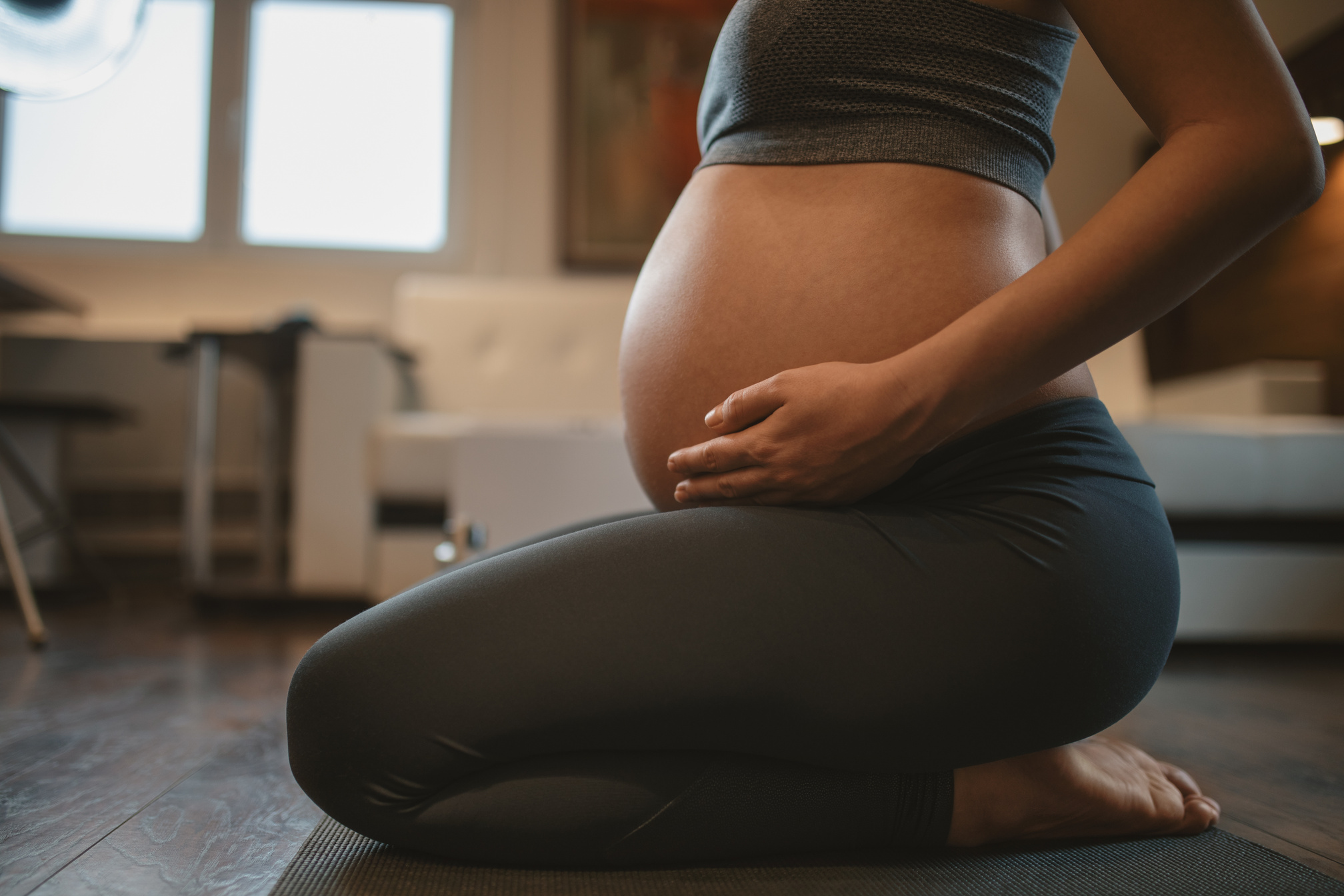 Pregnant Woman Doing Prenatal Yoga at Home